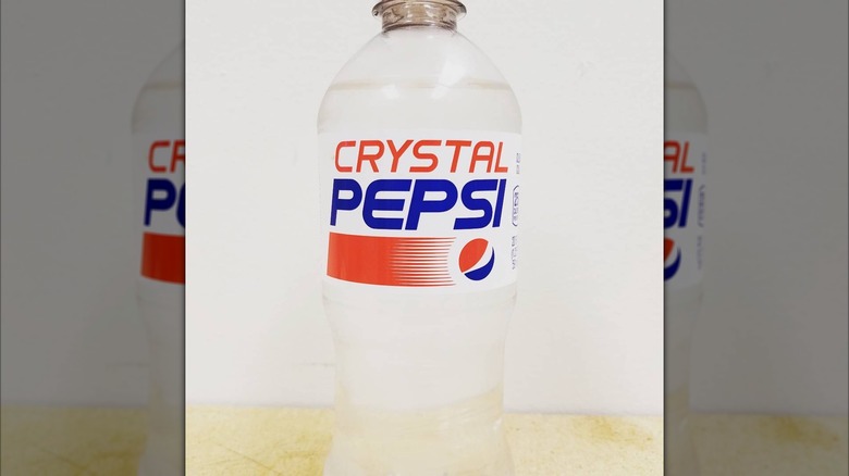 A bottle of Crystal Pepsi sitting on a table