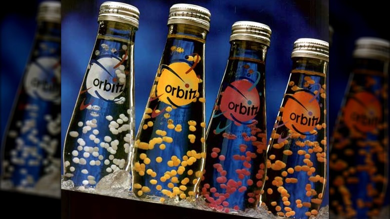 A row of four Orbitz sodas of different flavors