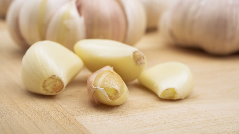 Garlic cloves on cutting board