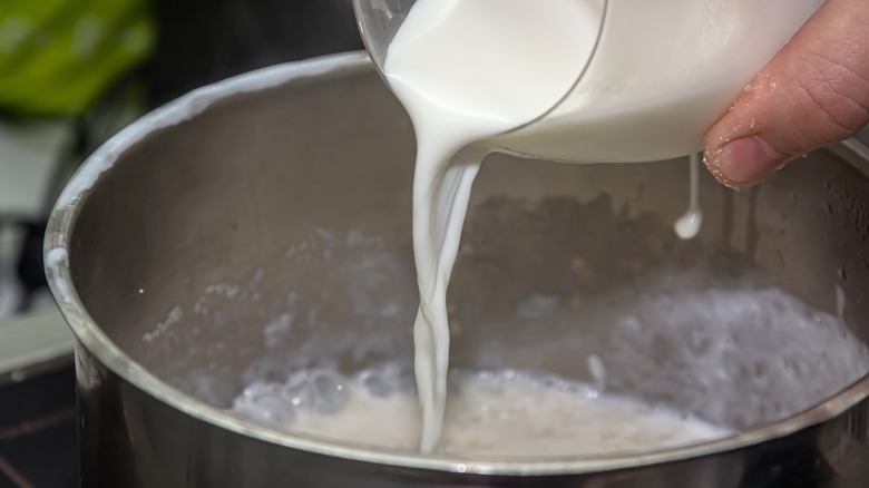 Cream being poured into pan