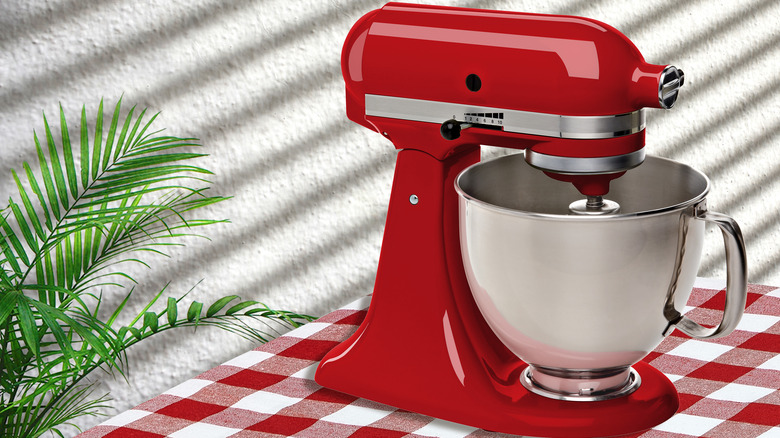 Red stand mixer on table