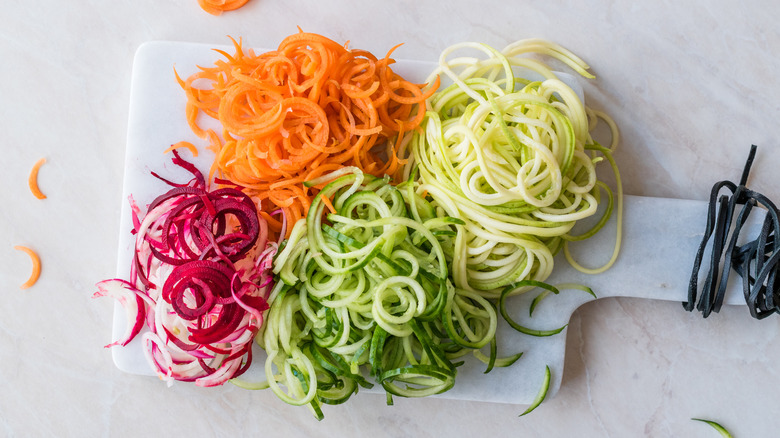 Veggie noodles on cutting board