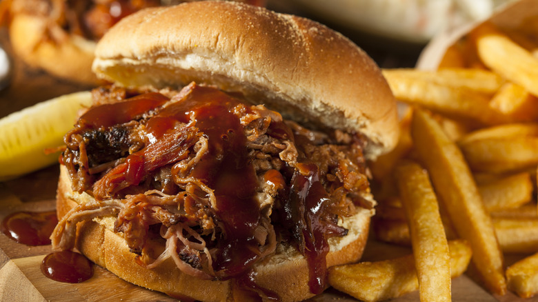 A barbecue pulled pork sandwich with a soft bun