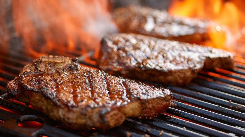 three charred steaks