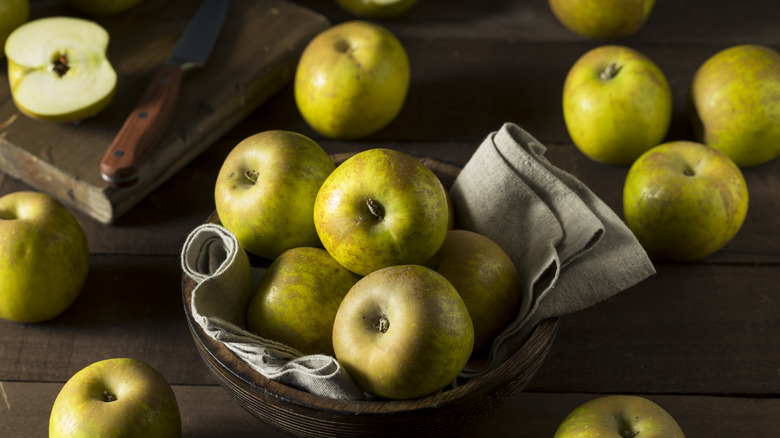 Golden Russet apples on wooden background