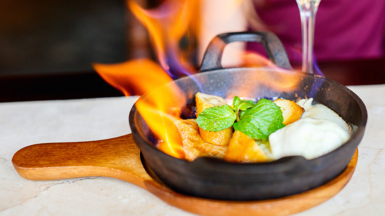 flambeed banana dessert in a single-serving pan