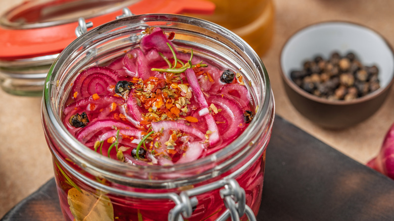 Homemade pickled red onions in a glass jar