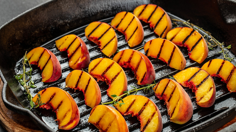Sliced peaches in a griddle pan