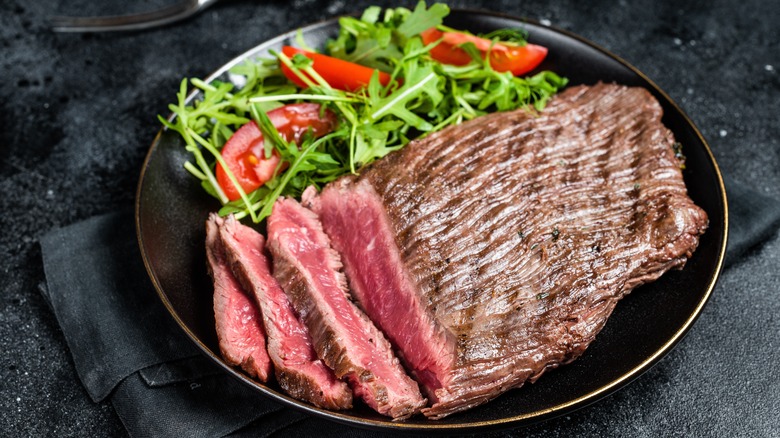 Rare flank steak on plate