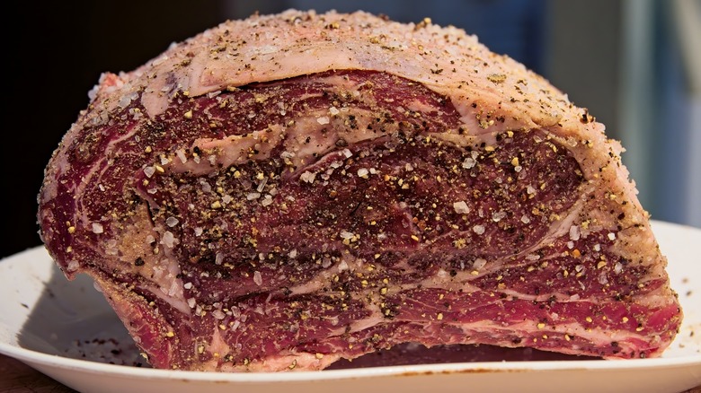 Raw, seasoned prime rib