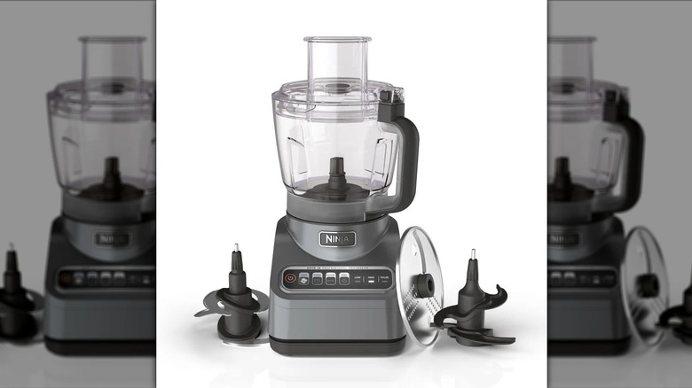Ninja Professional Plus on white surface with blades next to it