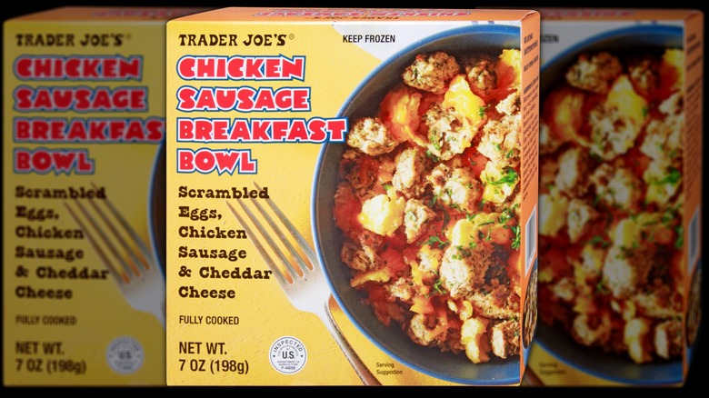 A box of the Trader Joe's chicken sausage breakfast bowl on a black background