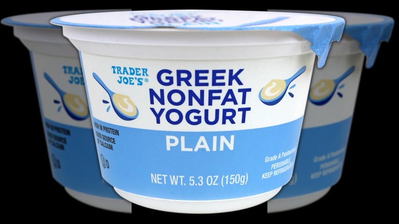 A carton of Trader Joe's Greek yogurt on a black background