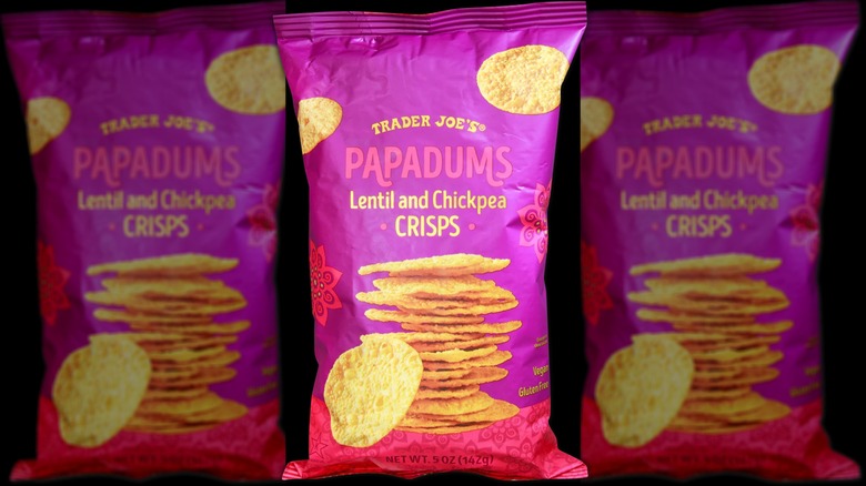 A bag of Trader Joe's papadums crisps on a black background