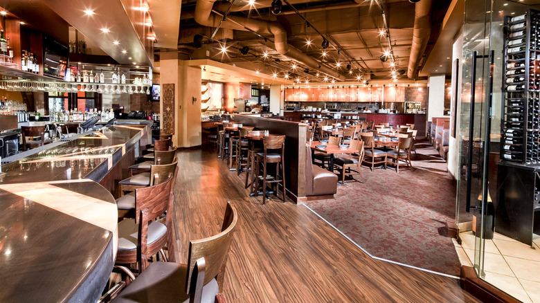 Interior of CRAVE American Kitchen & Sushi Bar showing bar and dining area