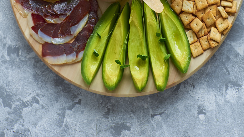 platter with veggies, toast, and multiple spreads