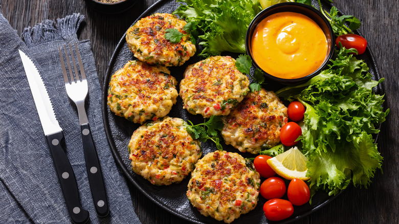 A plate of crab cakes served with remoulade