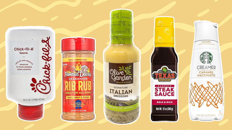 5 bottles of condiments on yellow background