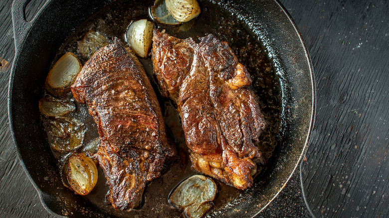 Flank steaks in a pan