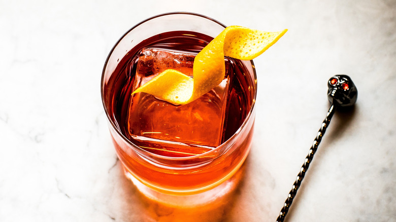 Sazerac cocktail with one large square ice cube