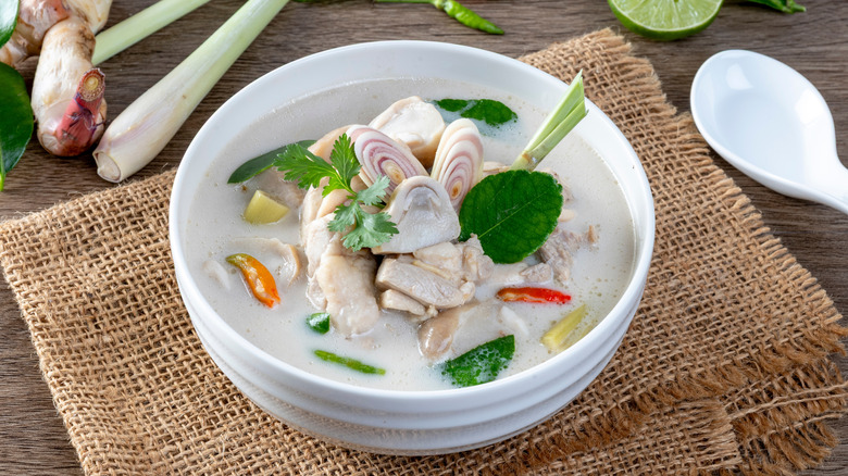 A white bowl of Thai coconut soup
