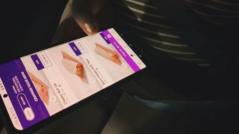 Woman ordering Taco Bell food from an app