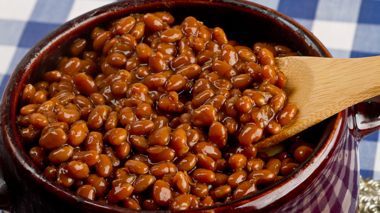 Baked beans with wooden spoon