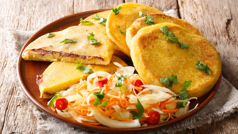 A plate of vegetarian pupusas with salad