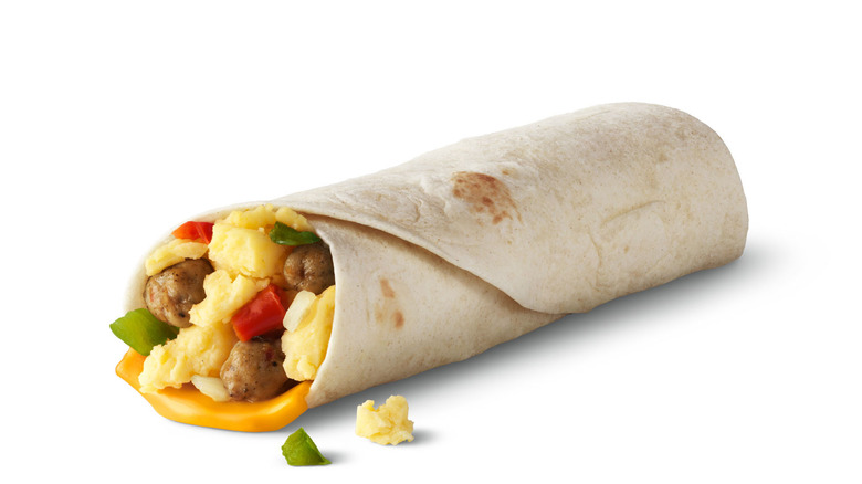 A McDonald's sausage burrito with eggs, peppers, and cheese