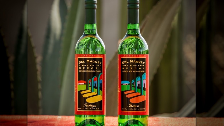 A bottle of Del Maguey Pechuga beside a bottle of Del Maguey Ibérico