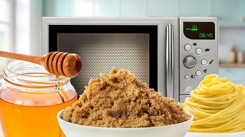 Microwave in background behind honey, brown sugar, and pasta noodles