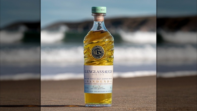 A bottle of Glengassaugh Sandend Single Malt Whisky on the beach