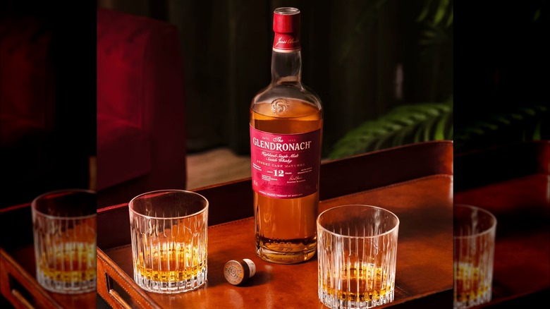 A bottle of The Glendronach 12 Year Single Malt Scotch Whisky with two glass of whisky