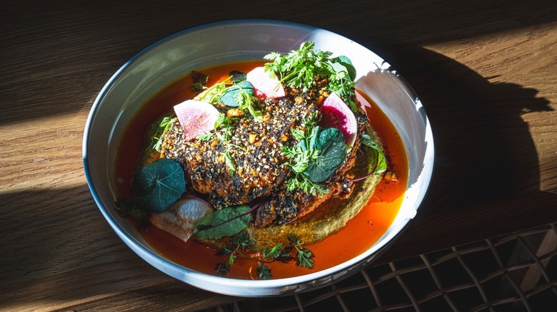 Mírate's fried chicken with black garlic salsa macha in a bowl