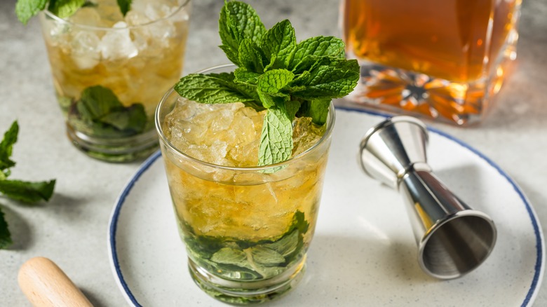 A mint julep cocktail garnished with mint