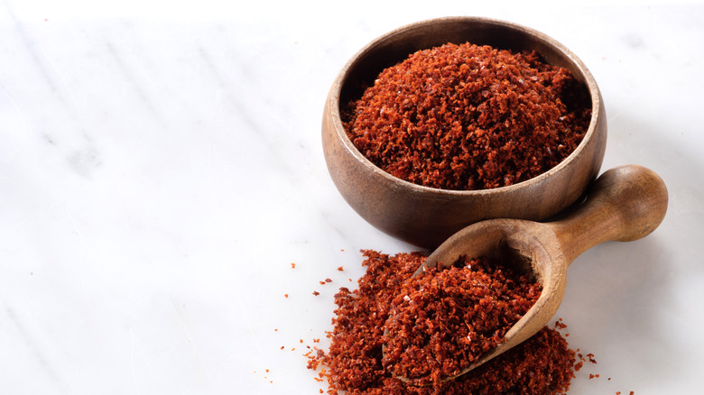 wooden bowl of paprika powder