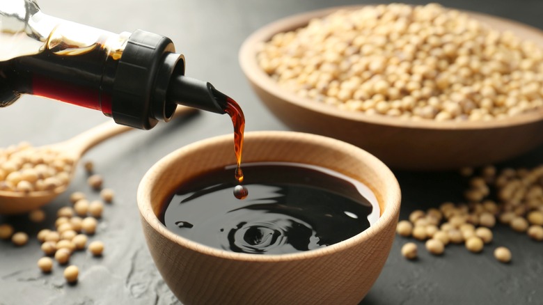 soy sauce pouring from bottle