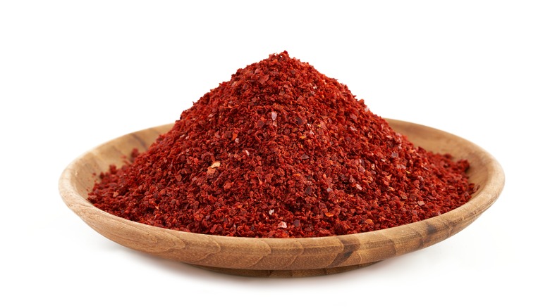 Chili powder in wooden bowl