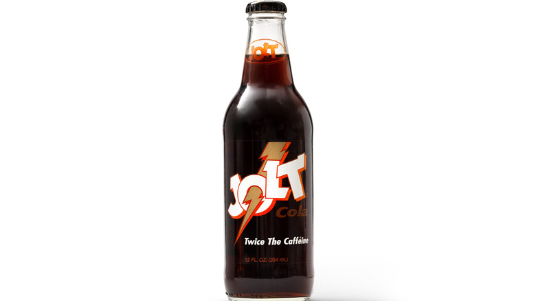 A bottle of Jolt cola against a white background