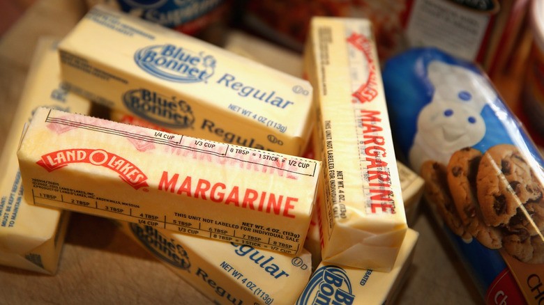 Several sticks of Land O Lakes and Blue Bonnet margarine