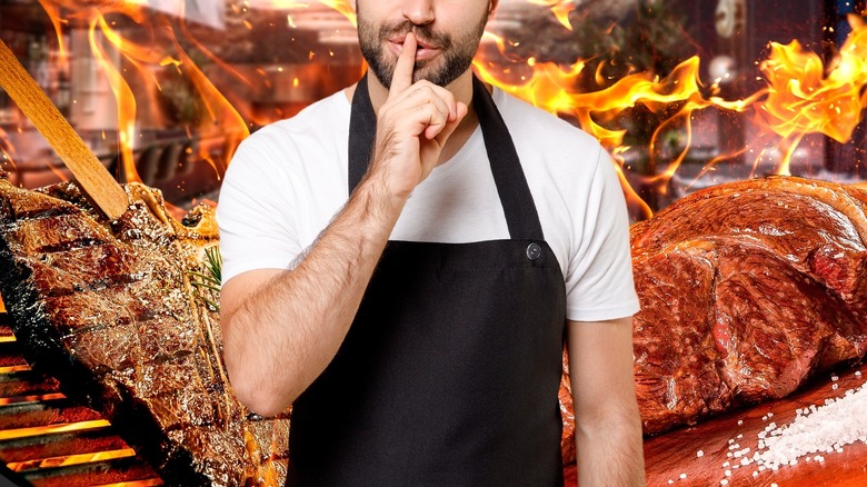 Chef against grilled meat background