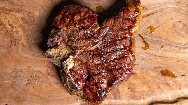 Steak resting on cutting board