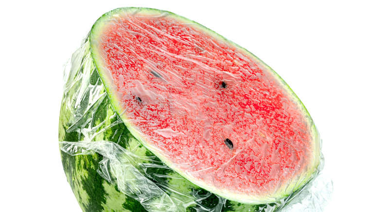 watermelon covered with plastic wrap