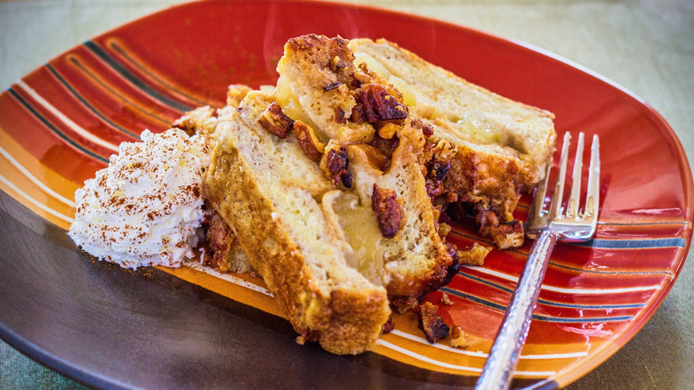 Stuffed French toast on a red, orange, and black plate