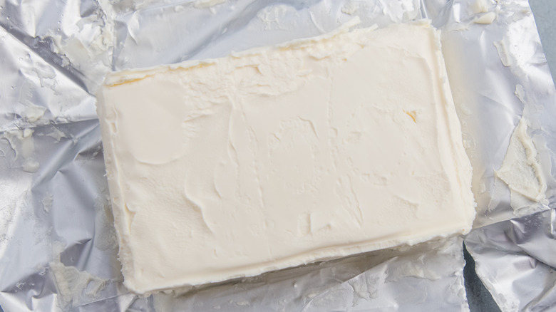 Open pack of cream cheese