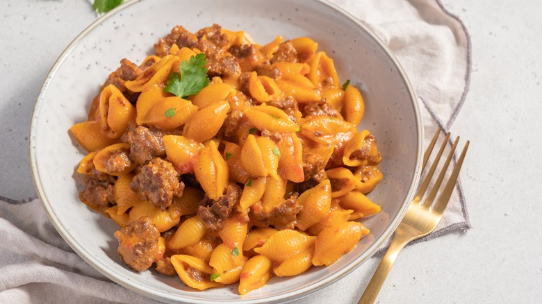 Bowl of mac and cheese with meat