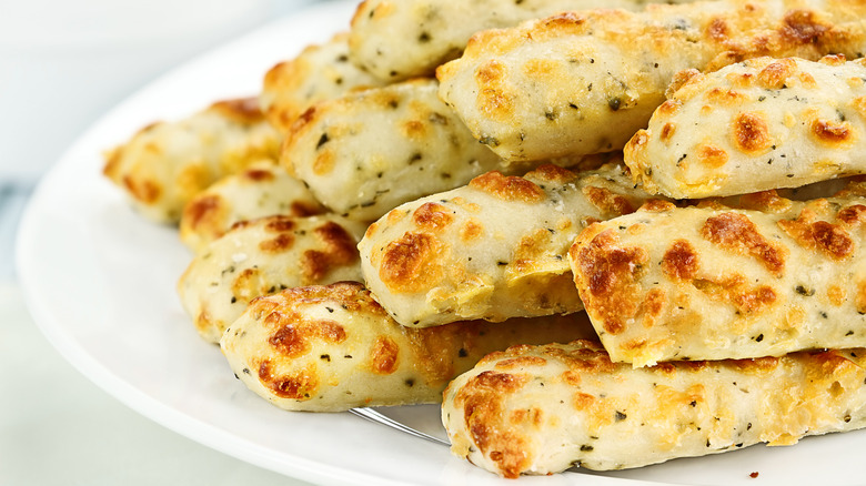 Plate of cheesy macaroni breadsticks