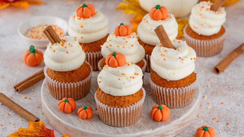 5 mini pumpkin cupcakes on a plate