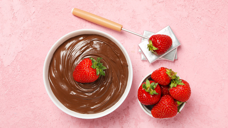 Strawberries and a bowl of chocolate fondue
