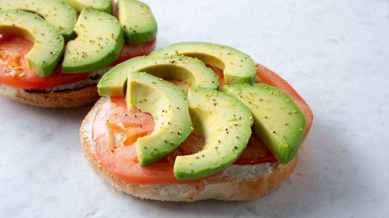 Bagel with sliced avocado